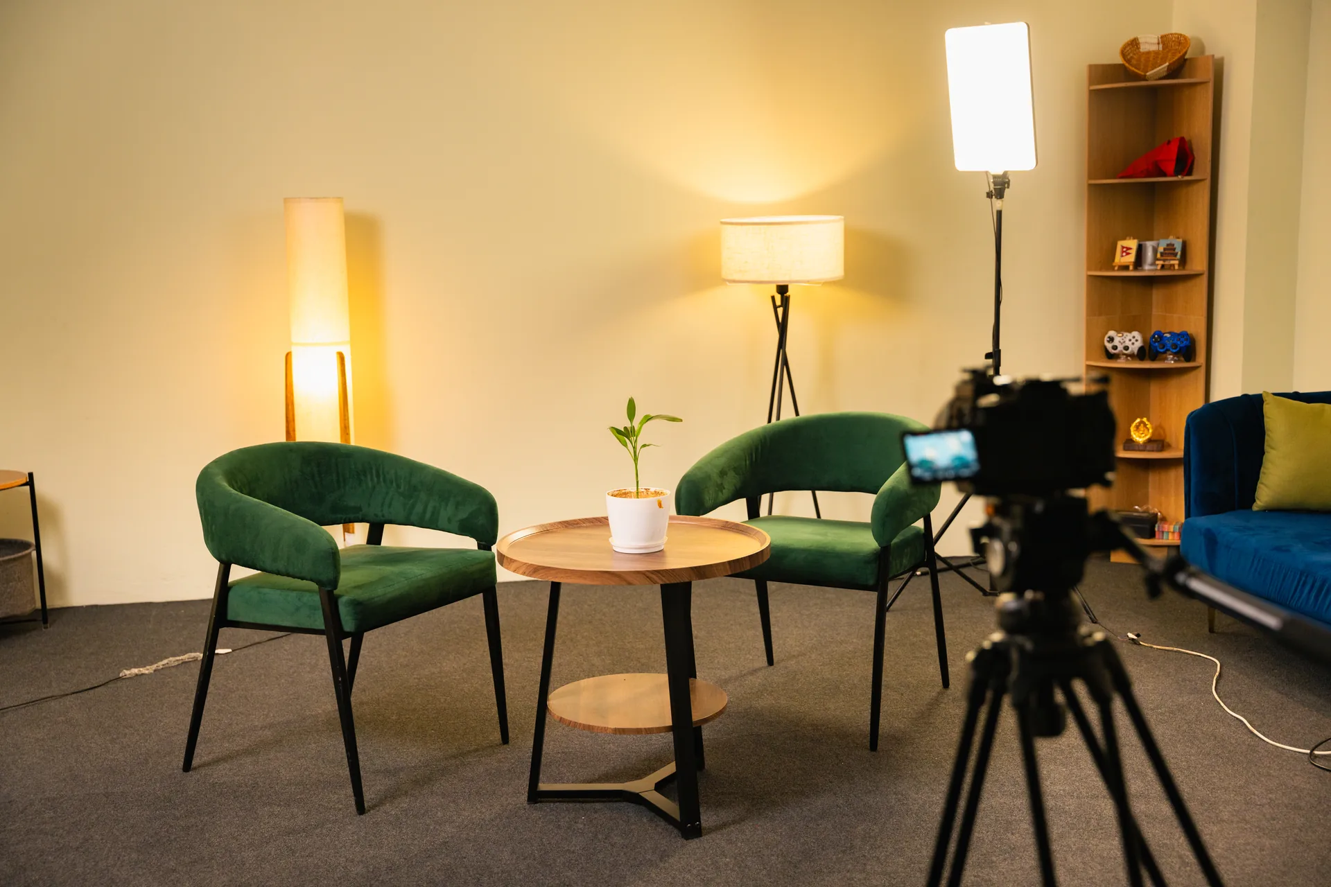 Two green chairs on Pana Studio interview set